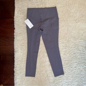 NWT - Athleta Salutation Stash Pocket II 7/8 tights - never worn Size L purple